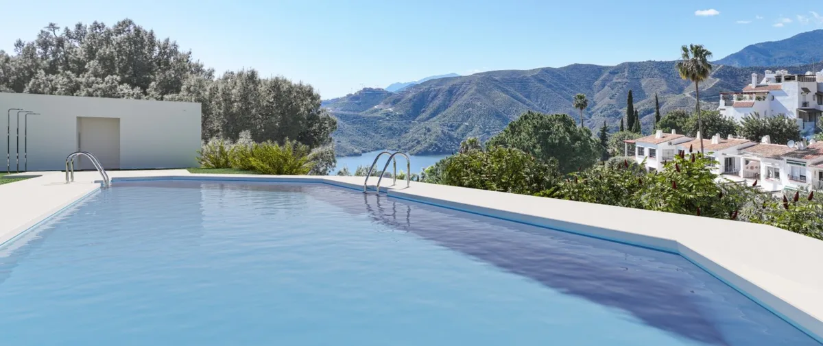 Render of the communal pool with entry handrails, a light-coloured pool surround and distant hills.