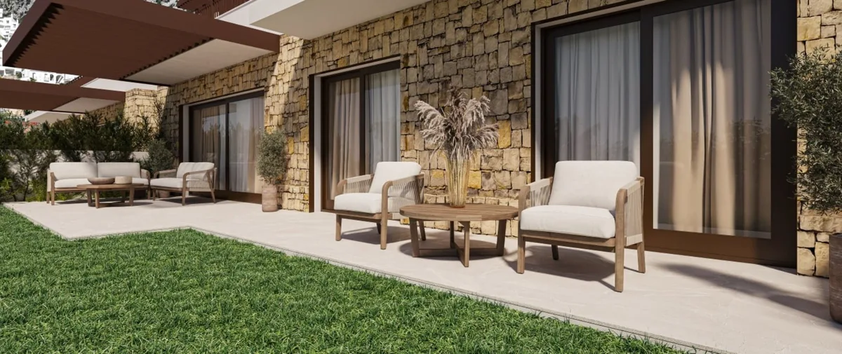 Render of a garden terrace with stone cladding, sliding doors, outdoor seating and a lawn.