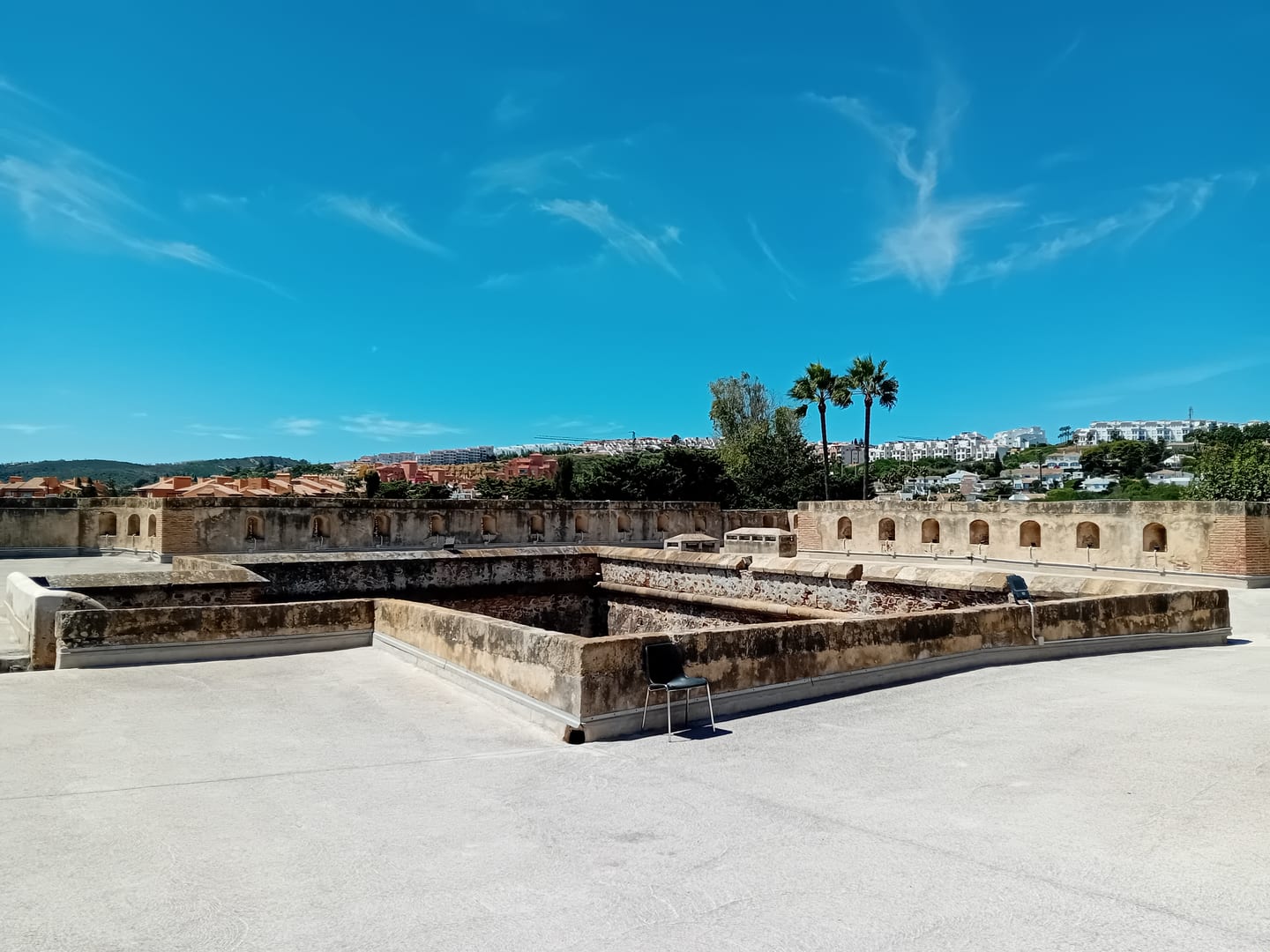 Area photograph near PURE SUN II showing Castillo de la Duquesa rooftop battlements and fortified walls, Manilva, Málaga, Andalucía, Spain