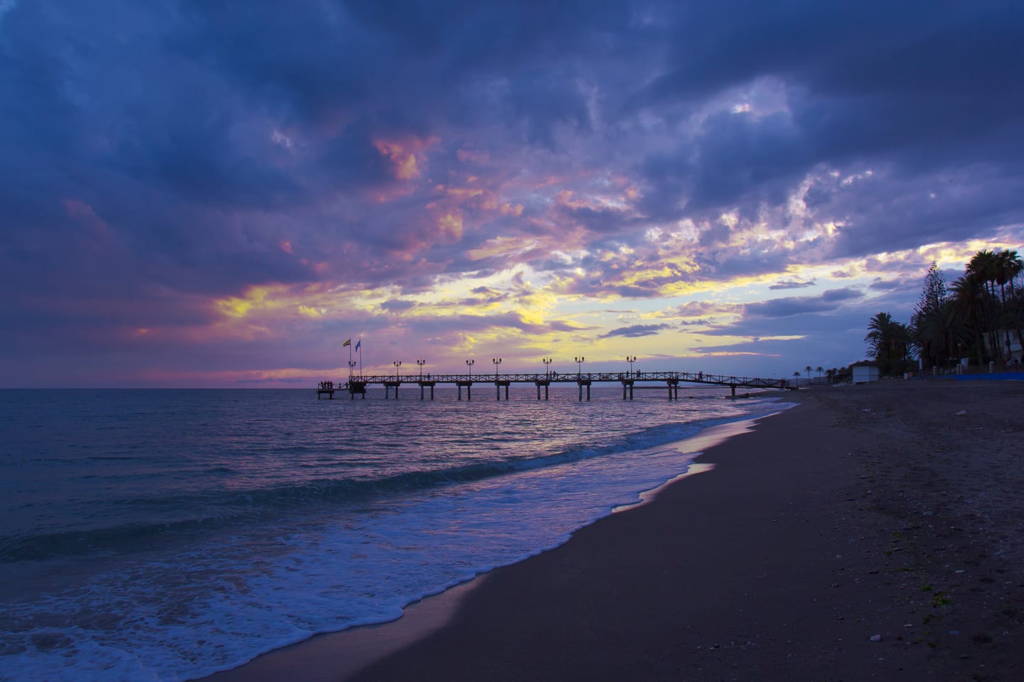 Marbella Club pier and Golden Mile beach at sunset, Marbella, Costa del Sol, shown as local context near ERNIRA