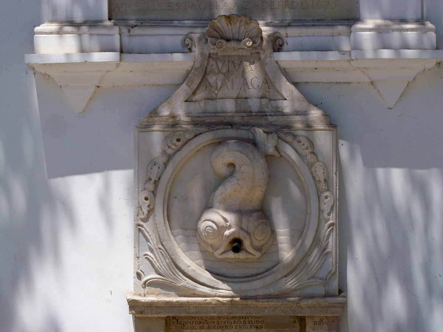 LUXY SANCHA area photograph of the marble fish figurehead and water spout of the historic Reding Fountain (Fuente de Reding), Paseo de Sancha, Málaga