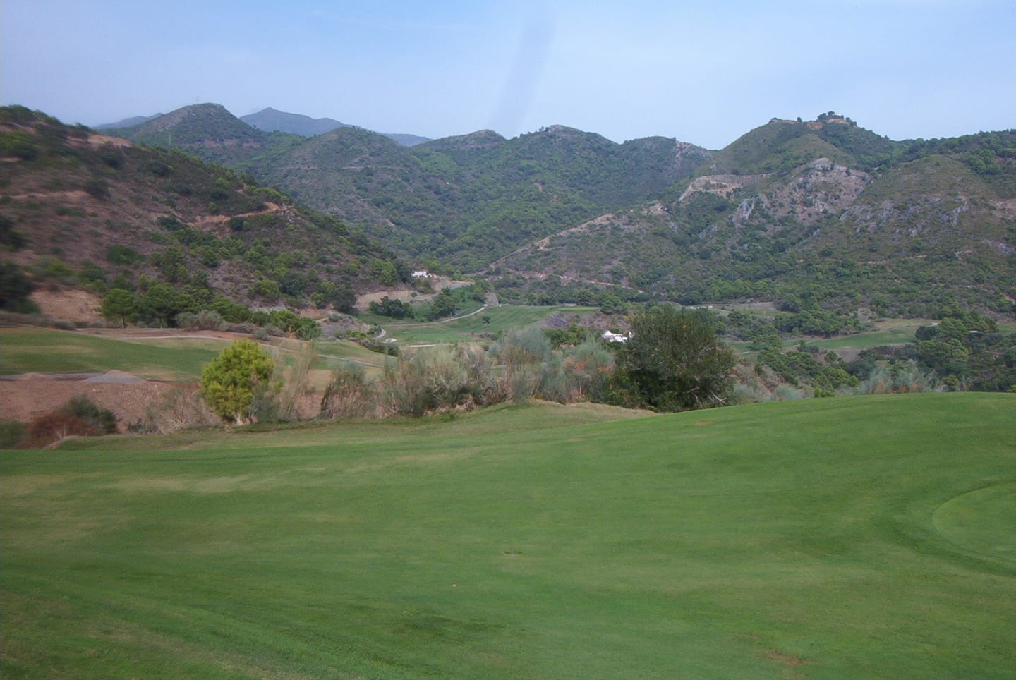 Monte Mayor golf course fairway with Benahavís mountain backdrop, Andalusia, Spain, shown as local context near VILLA MAXIMUS