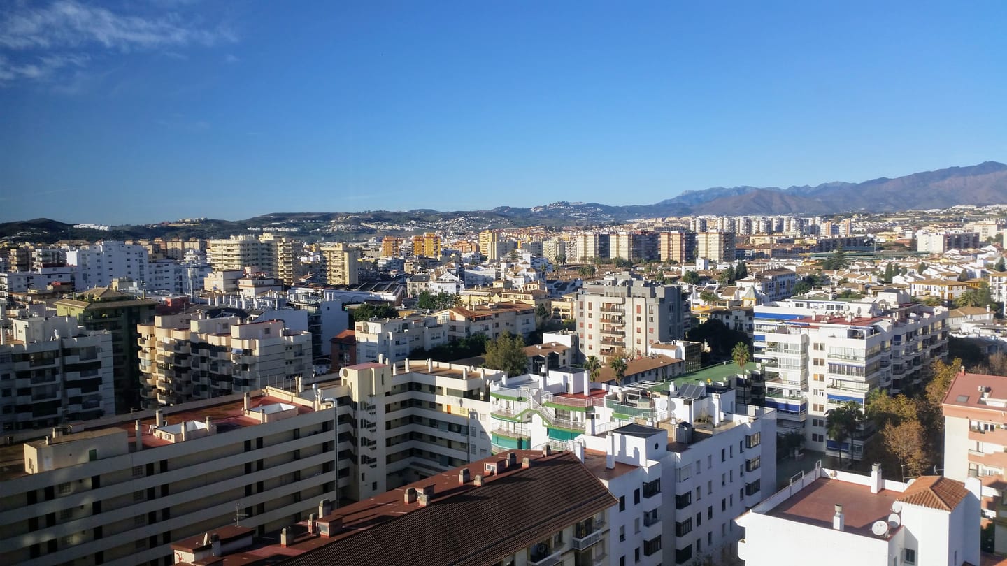 NOVA MARINA: panoramic view of western Fuengirola's residential and commercial urban area with the Sierra de Mijas mountains in the background, Andalusia, Spain. The photograph was taken from the highest floor of Hotel Florida Spa.
