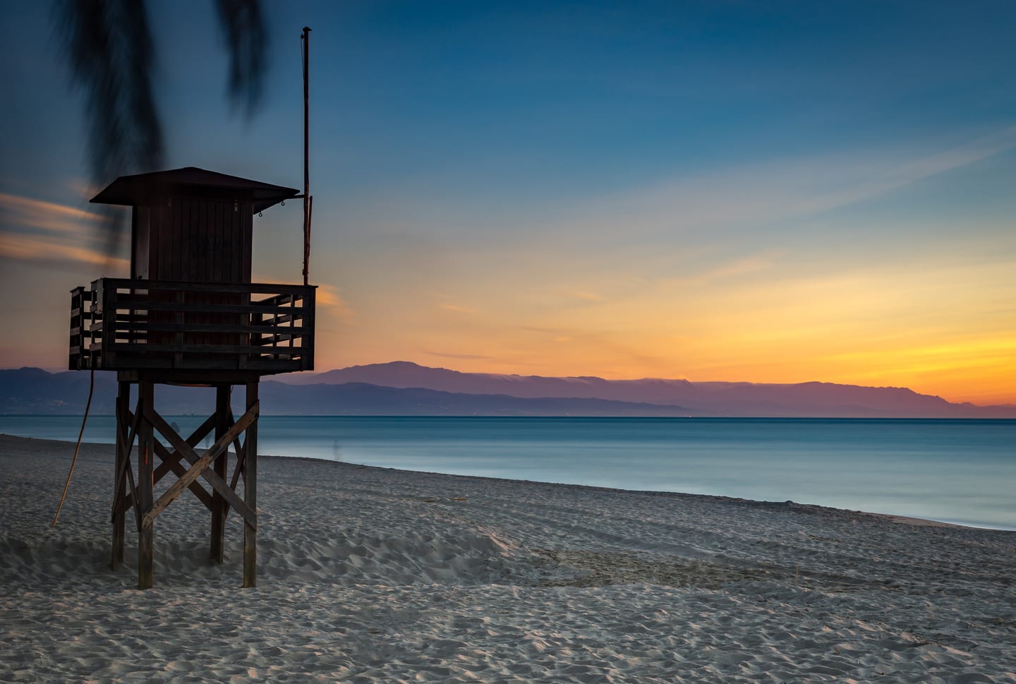 Playa de los Álamos beach in twilight with lifeguard tower, Torremolinos, Costa del Sol, near MAGNA TORREMOLINOS