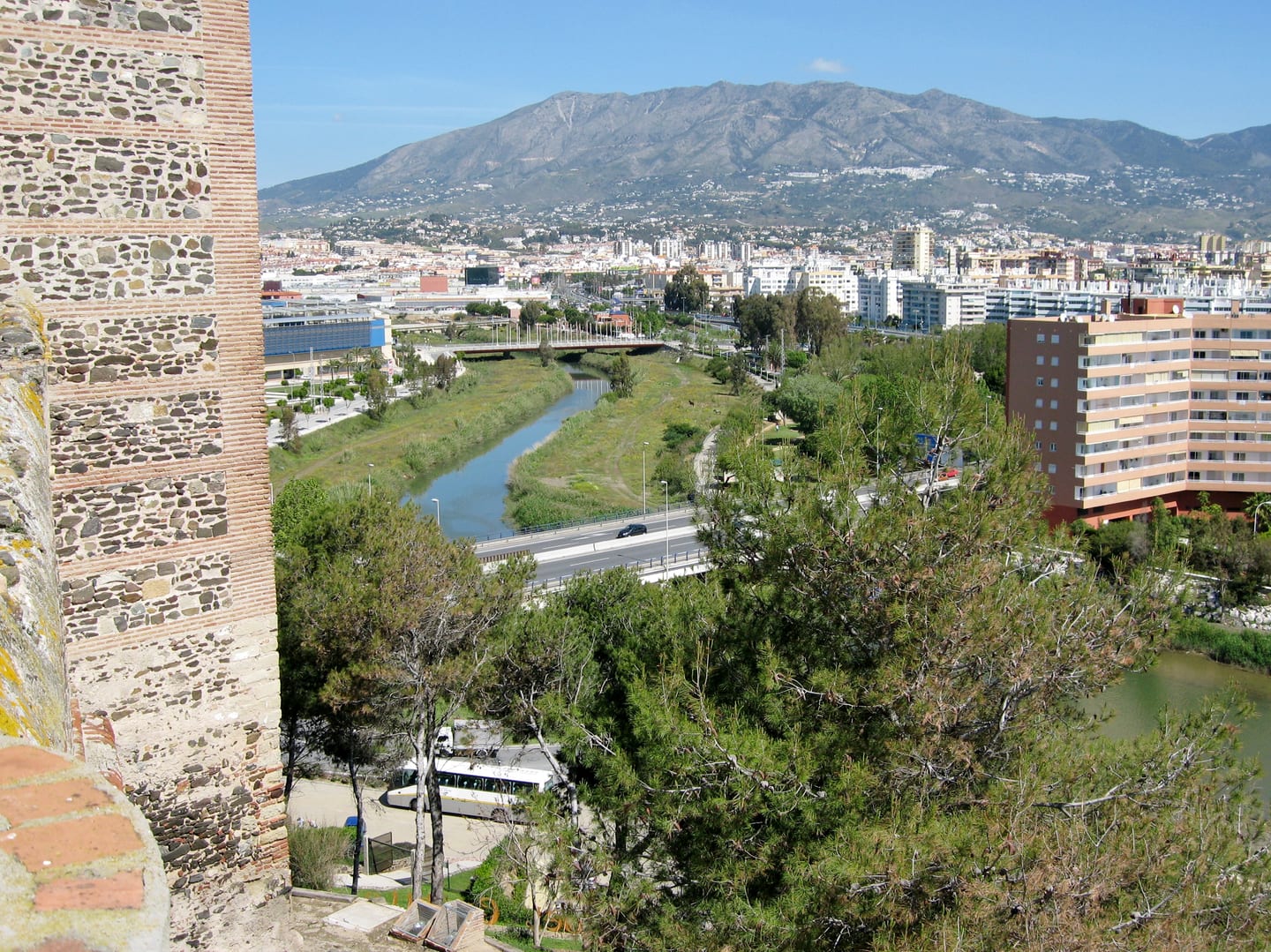 Río Fuengirola river corridor with Fuengirola townscape and mountain backdrop, viewed from Castillo de Sohail, shown as local context near JADE TOWER WITH FURNITURE