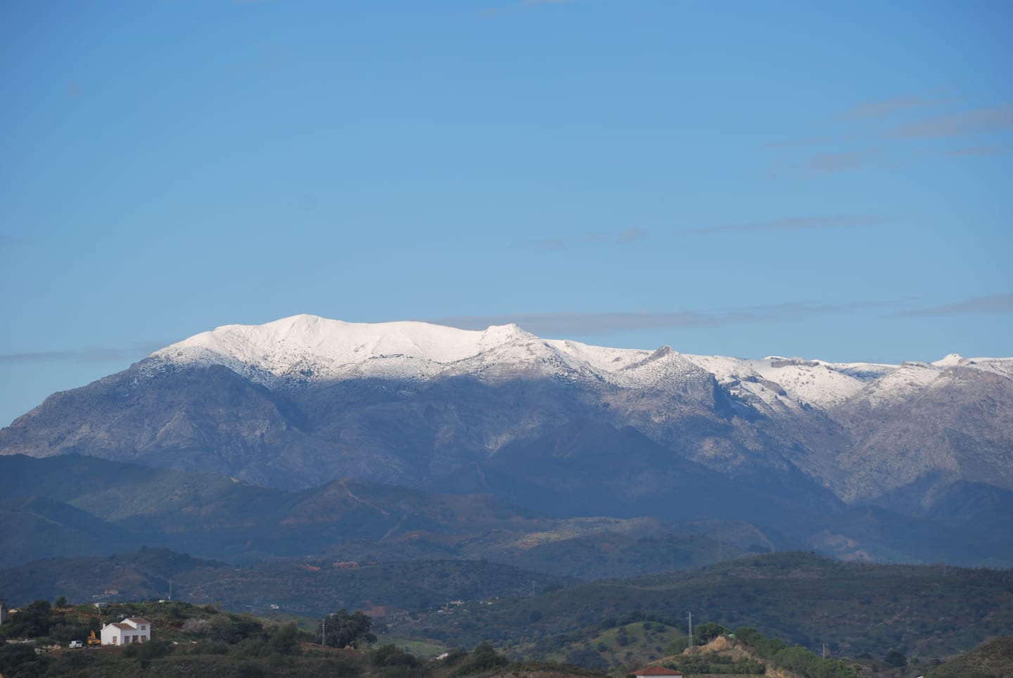 VILLA ALCALÁ DEL VALLE – distant view of the snow-capped Sierra de las Nieves mountain range seen from Coín, Málaga