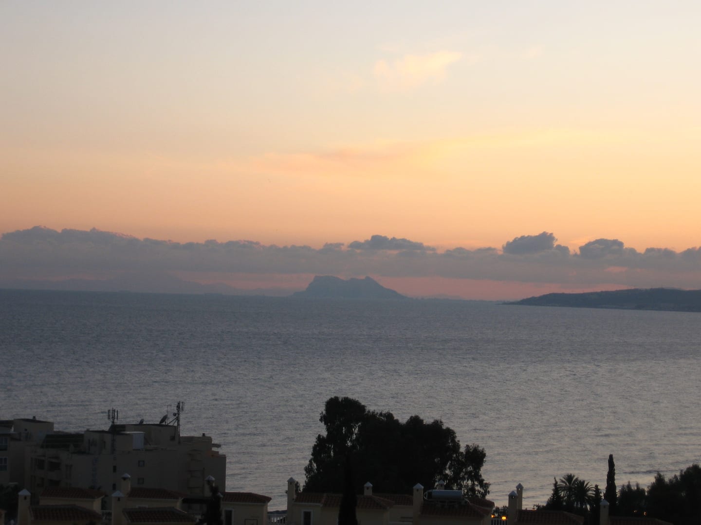 CELESTIA HOMES area photograph of a sunset across the Mediterranean Sea from Estepona towards the Rock of Gibraltar