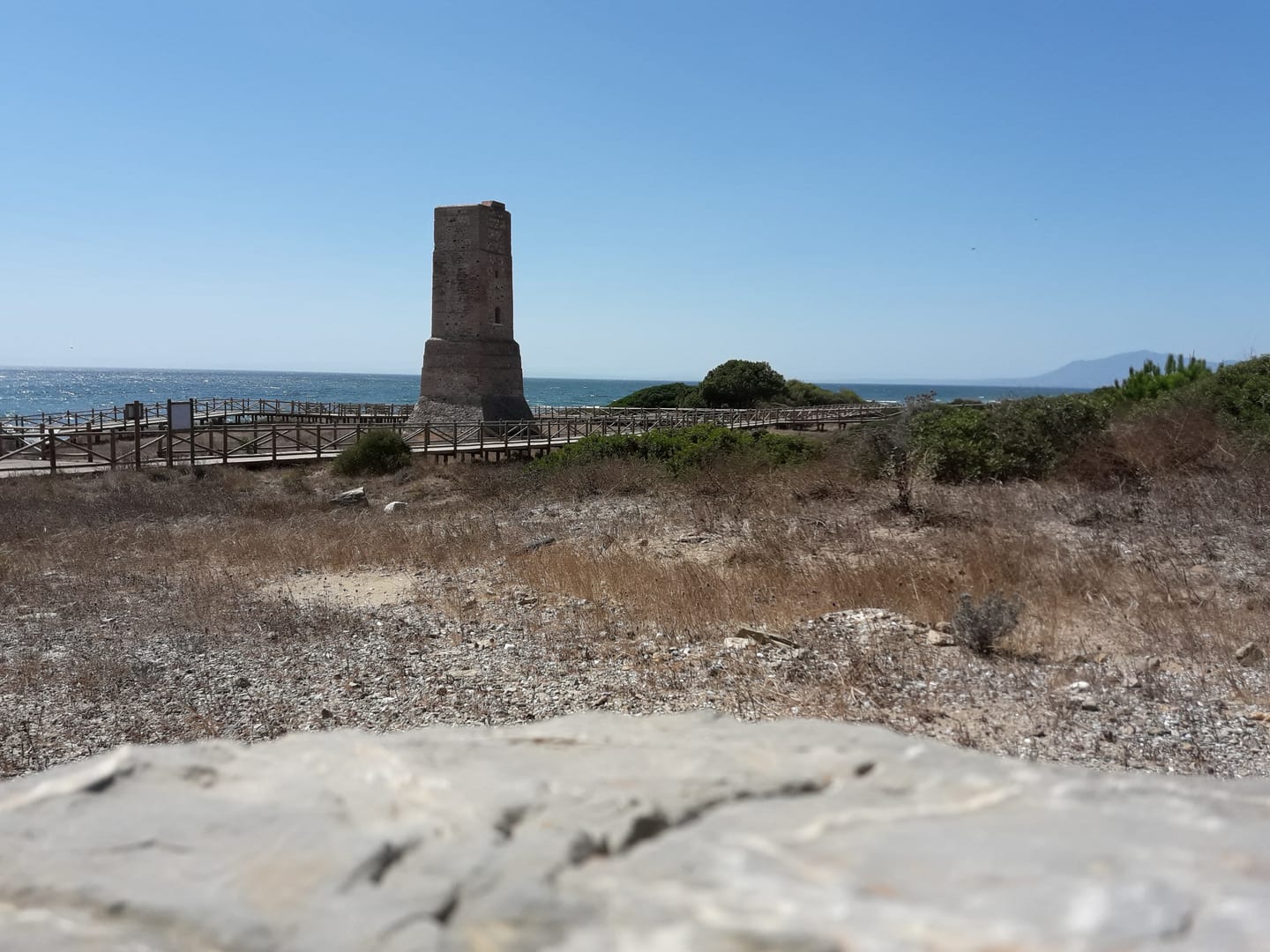 Torre de Calahonda coastal watchtower with Mediterranean Sea and protected dune landscape near Cabopino, shown as local context near AURA CABOPINO