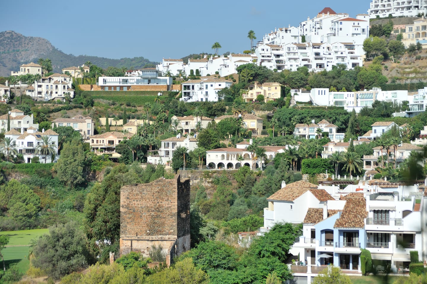 Torre Estéril historic watchtower with surrounding Benahavís hillside residential landscape, shown as local context near MADROÑAL VIEW - VILLA HOPE