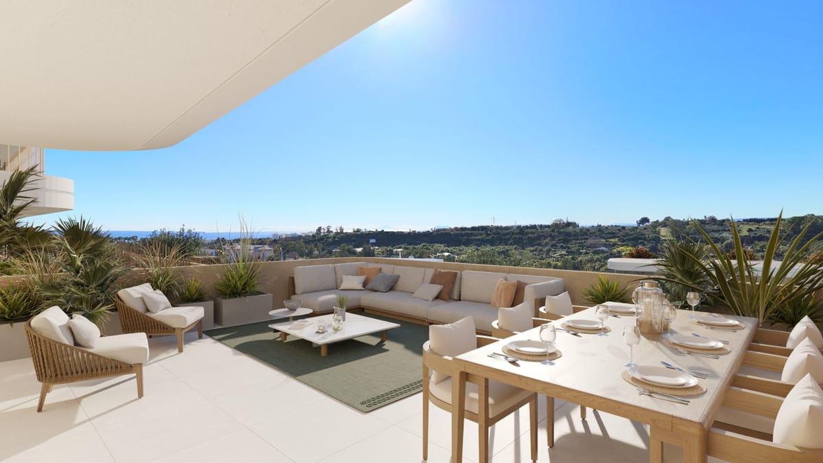 Project visualisation of ADAGIO with a spacious terrace featuring a dining table, lounge sofa, occasional armchair, wooden chairs, planters and views of green hills.