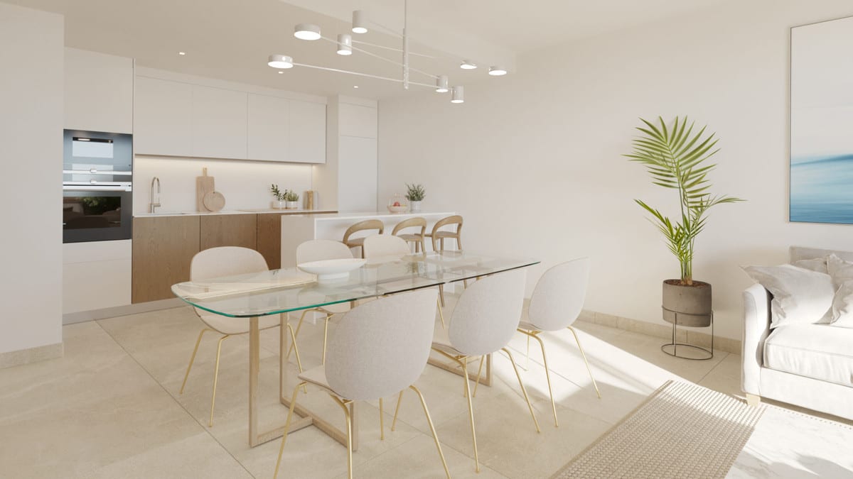 Project visualisation of ADAGIO with an open-plan kitchen, glass dining table, cream-coloured chairs with gold legs, white wall cabinets, wooden base cabinets and a light seating area.