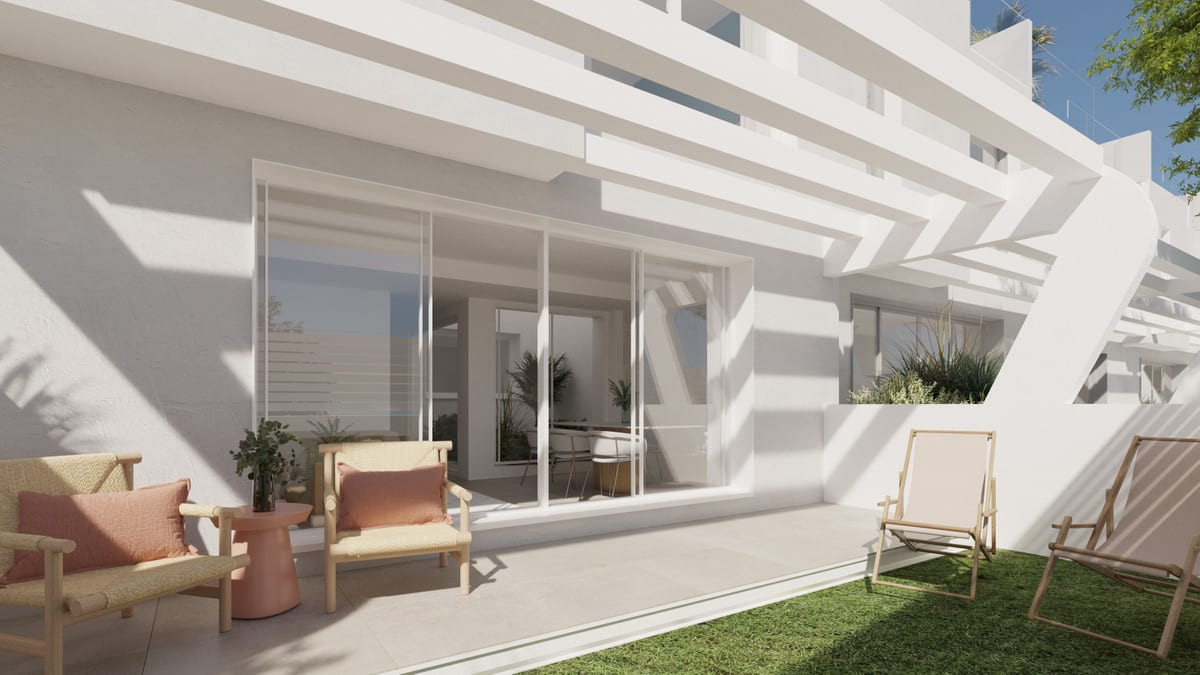 Project visualisation of ANNA DE ESTEPONA featuring a tiled terrace, lawn, wicker chairs with pink cushions, a small pink side table, a wooden sun lounger and sliding glass doors.