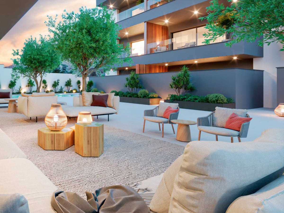 Project visualisation of ARTEMISA with a furnished outdoor terrace, swimming pool in the background, trees and balconies with wooden screens.