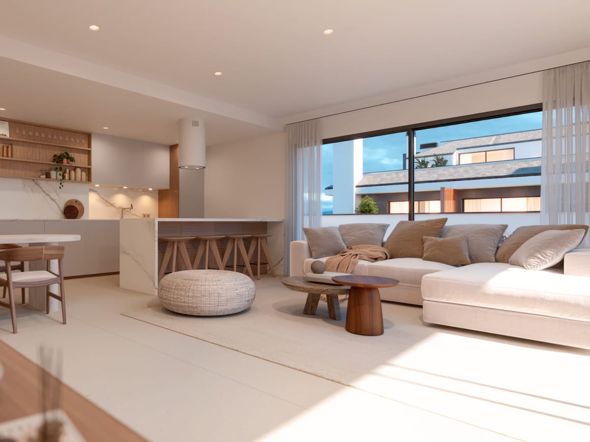 Project visualization of ARTEMISA with a bright living room, open kitchen with marble-look island, wooden bar stools and a large window with light curtains.