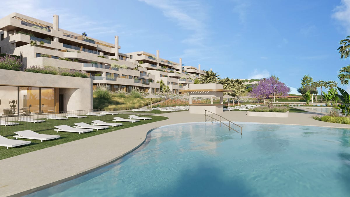 Rendered project visualisation of ATRIA - PHASE 1 viewed from the swimming pool, with white sun loungers on grass, flowering planting, a jacaranda tree and the tiered buildings in the background.