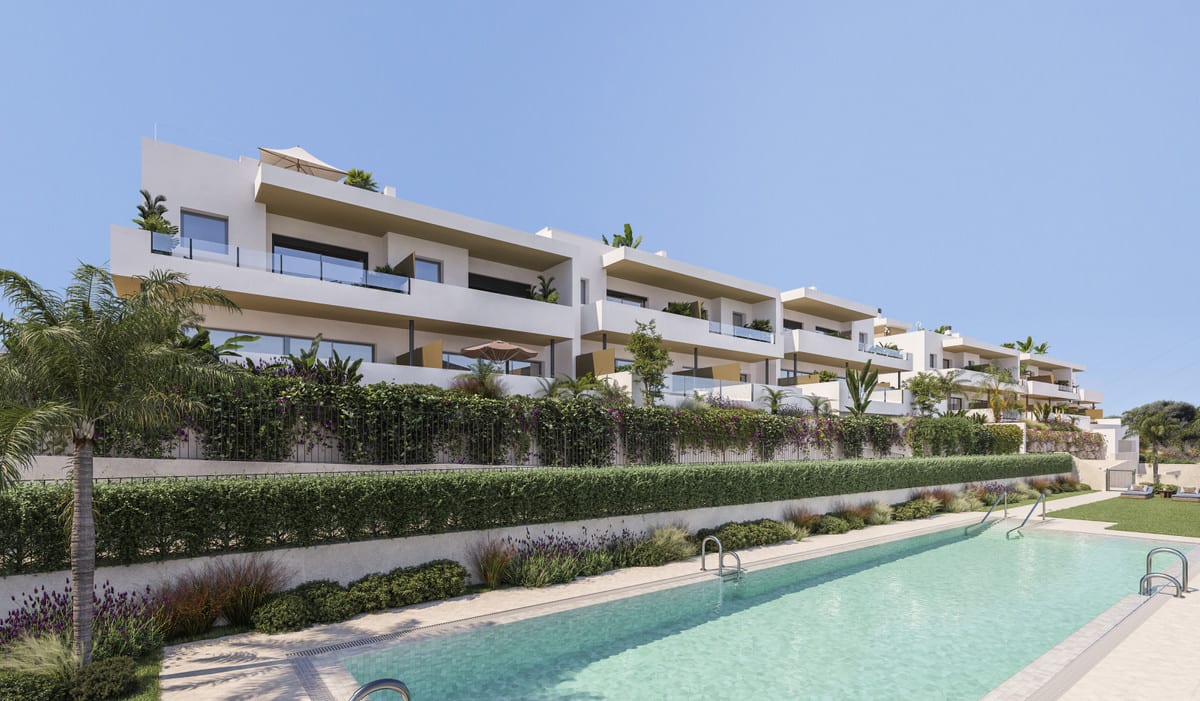 Project visualisation of ATTIRE ESTEPONA featuring white buildings, dark metal balcony railings, terrace planting with hedges and lavender, and a long rectangular outdoor swimming pool in the foreground.