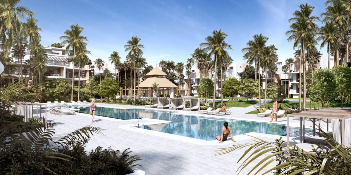 Project visualisation of AYANA ESTEPONA featuring a large swimming pool, sun loungers, a thatched pavilion, palm trees and a light-coloured canopy on the right beside surrounding white buildings.