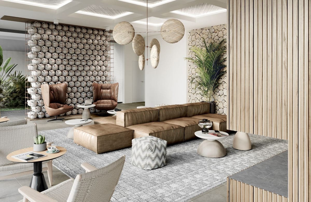 Project visualisation of AYANA ESTEPONA showing a lounge interior with a brown leather modular sofa, two leather armchairs, round woven pendant lights and a wall of spherical decorative elements in a metal grid.