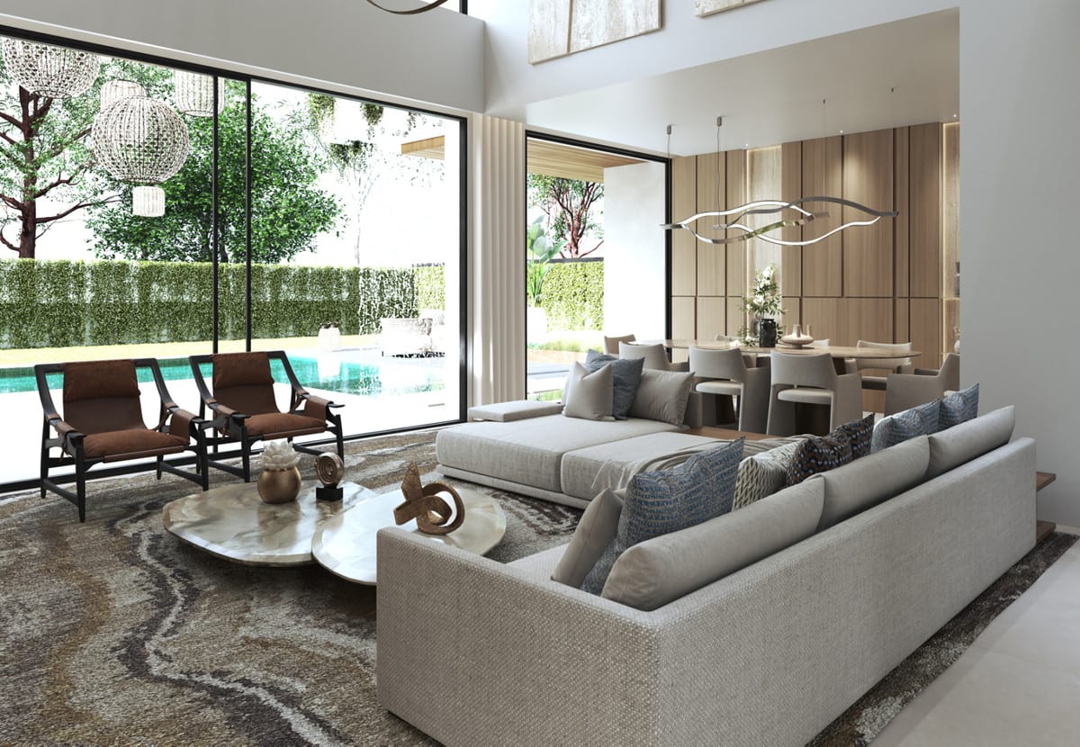 Another view of the living area at BE SEVEN, opening towards the pool through large sliding glass doors.