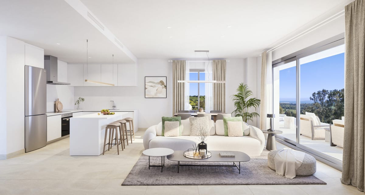 Project visualisation of BIRDIE HILLS featuring an open-plan living space: a white kitchen with an island and bar stools, a cream sofa, a coffee table and wide sliding doors leading to the terrace.
