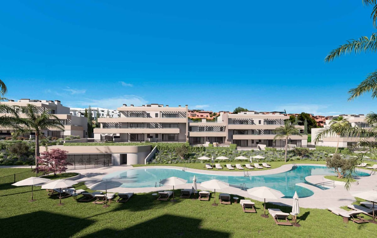 Development visualisation of BLISS HOMES featuring a spaciously shaped outdoor swimming pool, lawns, sun loungers, parasols and buildings with terraces.
