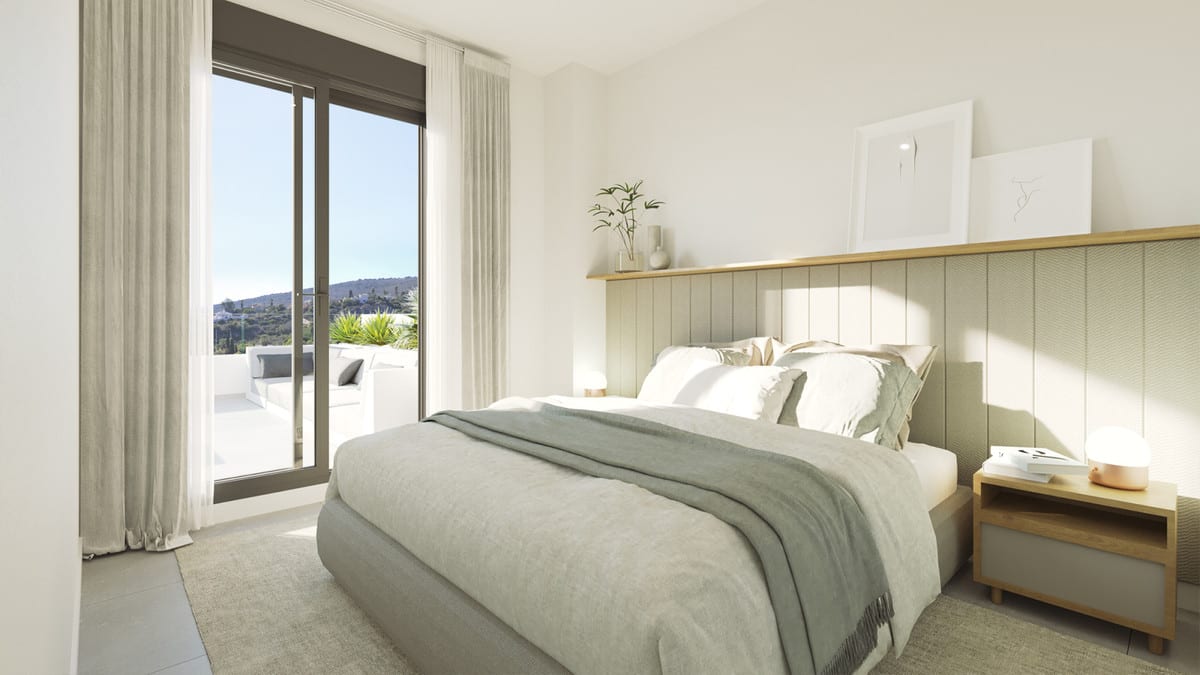 Rendered project visualisation of a bedroom at BLUE VIEW HEIGHTS with a double bed, sage-green upholstered headboard, wooden bedside tables and sliding doors to a terrace with hills in the background.