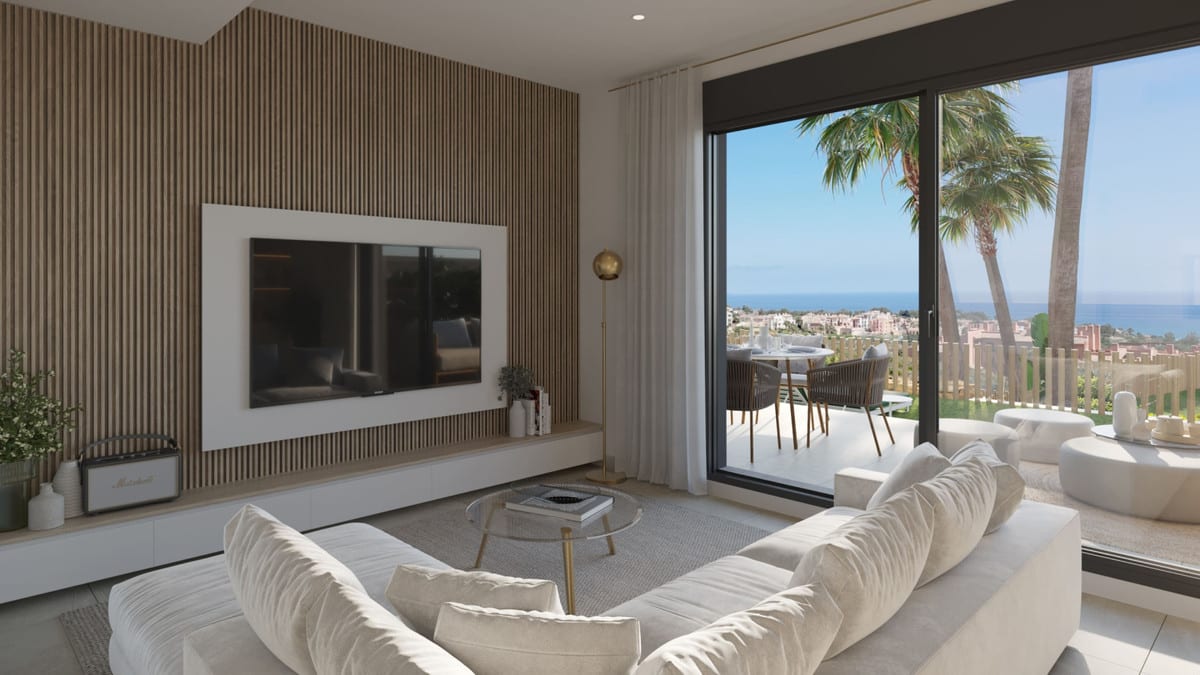 Rendered living room at BLUE WAVE with a wooden slatted feature wall, television, white sofa and glass sliding doors opening onto a terrace with palm trees and the sea in the background.