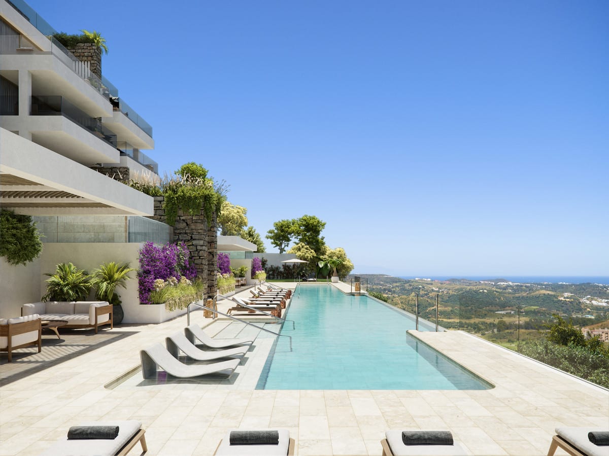 Rendered pool area at BOUTIQUE PROJECT with sun loungers, stone terrace flooring, planting and glass fencing.