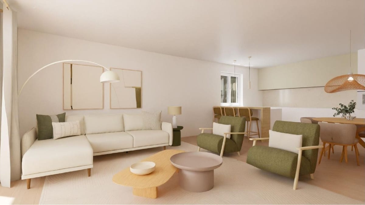 Interior visualisation of CALLE MIRÓ featuring a cream chaise longue sofa, two green armchairs with wooden frames, organically shaped yellow and pink-mauve coffee tables, an arched floor lamp and an open-plan kitchen with bar stools in the background.