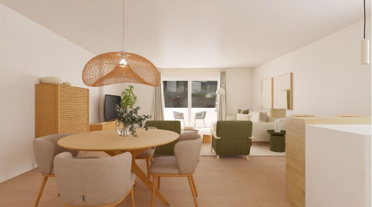 Interior visualisation of CALLE MIRÓ with a round wooden dining table, four taupe upholstered chairs, a large woven rattan pendant light, a wooden TV unit and cabinet in the background, and a cream seating area with a green armchair.