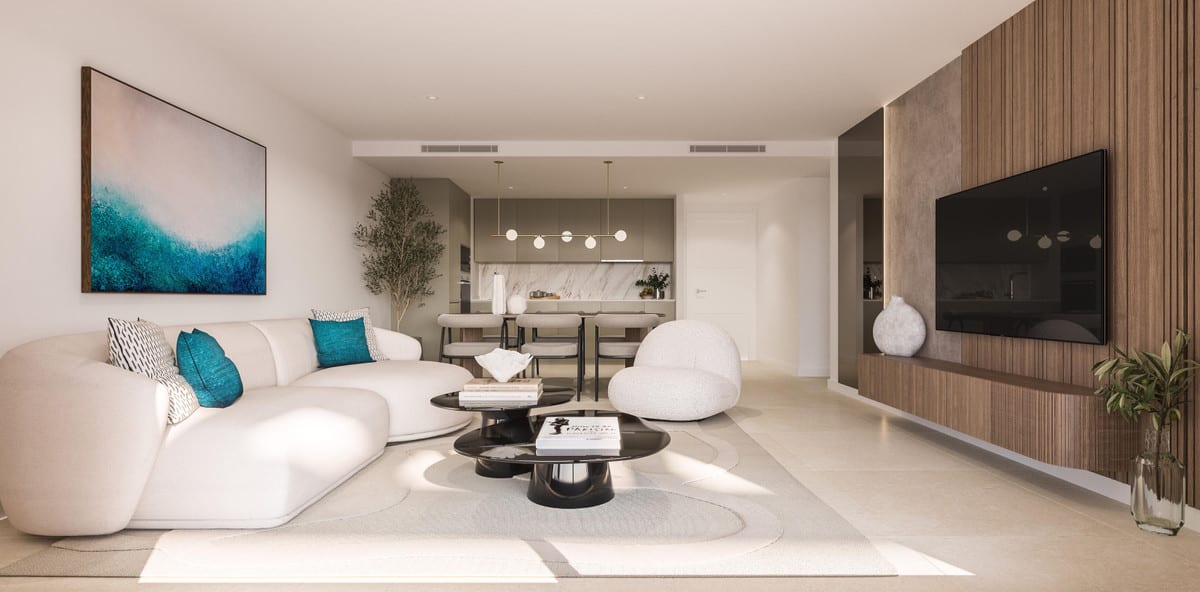 Project visualisation of CAPRI - FASE 2 featuring a living room with a curved white sofa, black round coffee tables, a wooden slatted wall with television, a blue painting on the wall and an open kitchen with a marble splashback in the background.