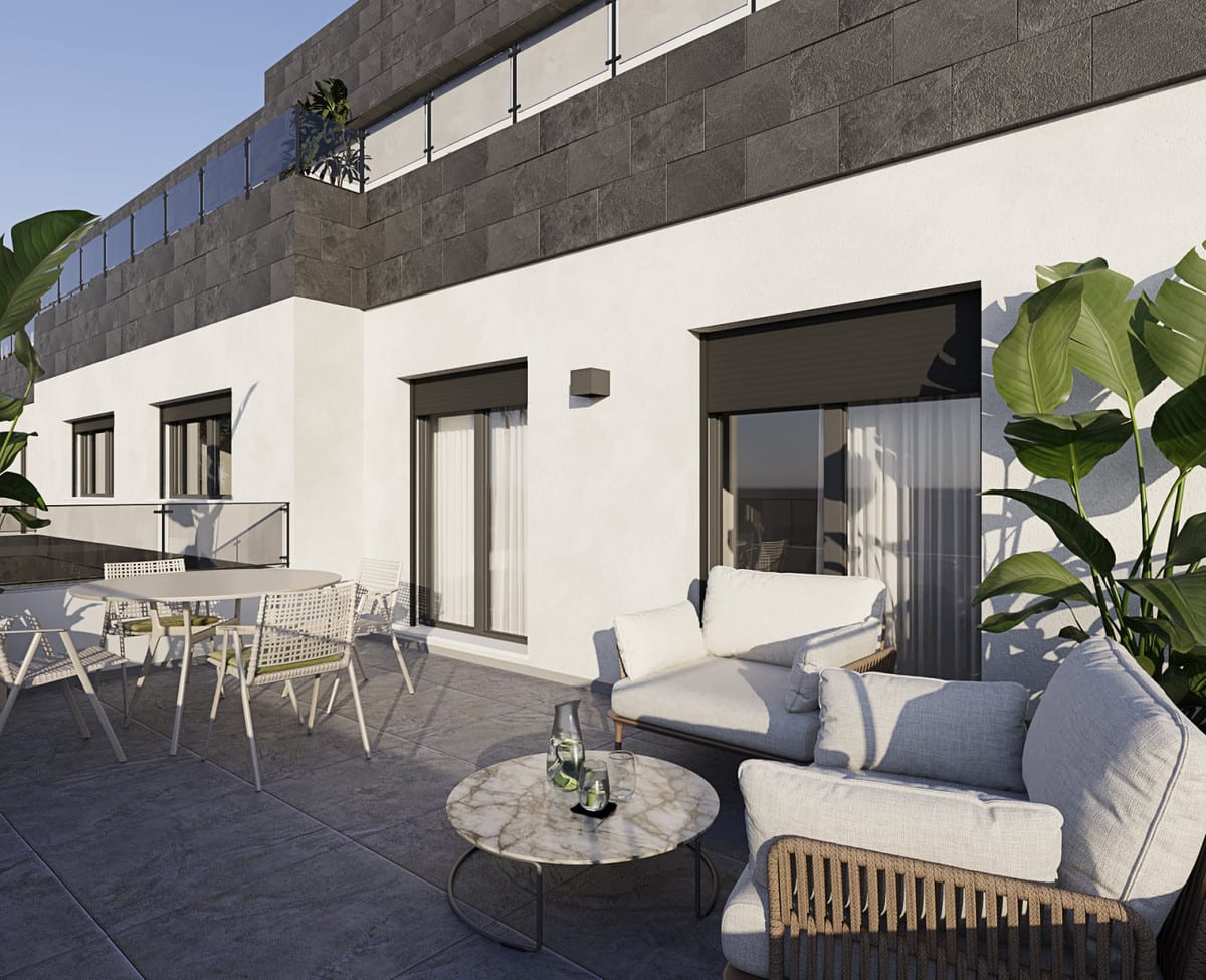 Project visualisation of CASARES BAY with a tiled terrace, lounge set with light-grey cushions, round marble-effect coffee table, separate dining area and large tropical plants against a façade of white render and dark stone cladding.