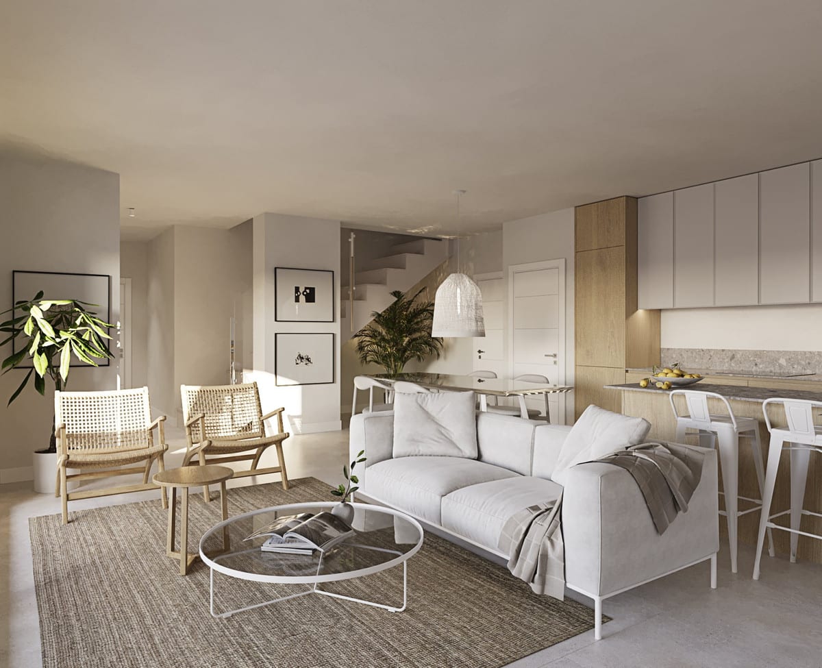 Project visualisation of CASARES BAY with an open-plan living room, light-grey sofa, two rattan armchairs, glass coffee table, kitchen with wooden and white cabinets, bar stools and a visible staircase in the background.