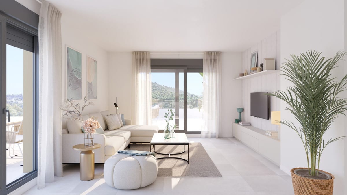 Project visualisation of the living room at CULMIA CALA SWING MIJAS FASE II with a light corner sofa, round pouffe, coffee table, television on a wall unit and two sliding doors overlooking a hilly landscape.