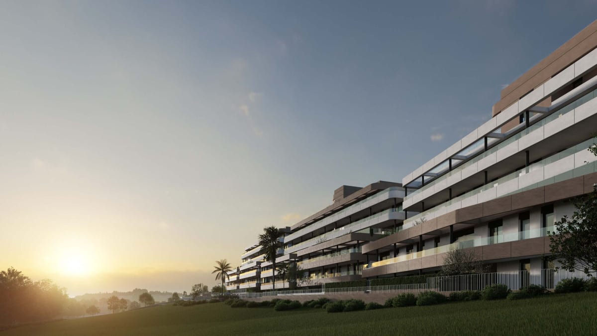 Project visualisation of EAGLE HILLS with elongated modern façades, glass balustrades, palm trees and a green lawn at sunset.