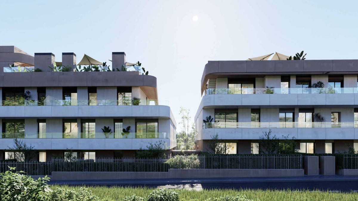 Project visualisation of EAGLE HILLS with two modern buildings, wide balconies with glass balustrades and a dark metal fence on the street side.