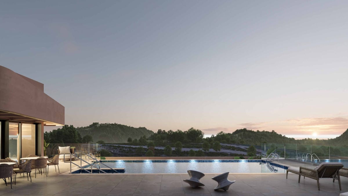 Project visualisation of EAGLE HILLS with a rectangular outdoor swimming pool with underwater lighting, glass screens, loungers and views of wooded hills at dusk.