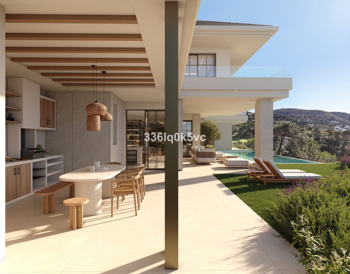 Visualisation of the covered terrace at EL QUEJIGAL, with an outdoor kitchen, dining area, lawn and pool.