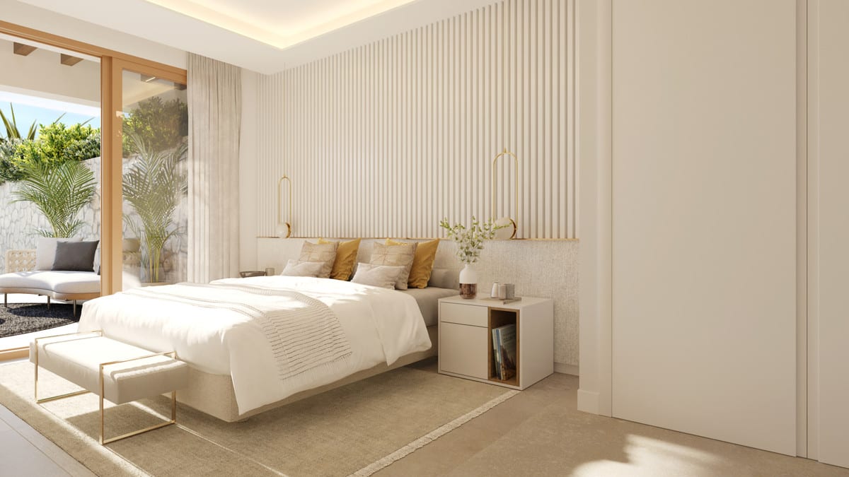 Project visualisation of ELYSEA SUITES with a bedroom, double bed, bedside table, footstool and sliding glass door leading to an outdoor seating area with planting.