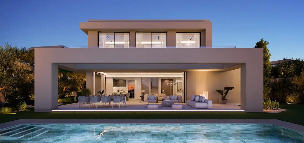 Evening exterior visualisation of the villa with an illuminated terrace and swimming pool.
