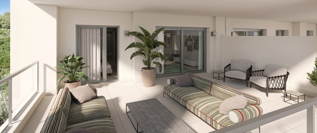 Project visualisation of a terrace at GRAND BAY APARTMENTS with two striped outdoor sofas, a dark metal armchair, a low rectangular coffee table, two large potted plants and sliding doors leading into the home.