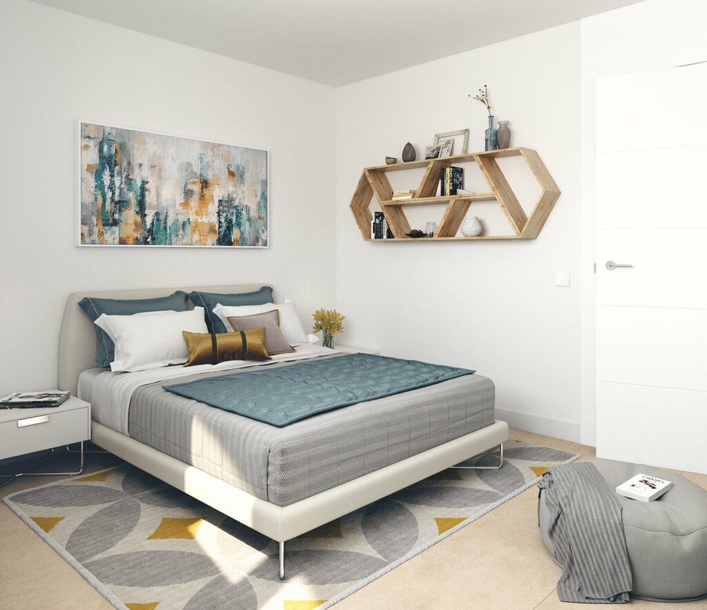 Project visualisation of a bedroom in HABITAT ALBORÁN - BORA with a low double bed, grey and yellow rug, geometric wooden wall shelving and grey pouffe.