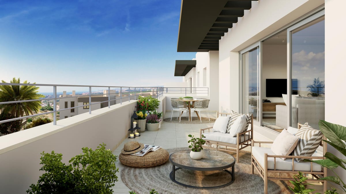 Spacious furnished terrace of an apartment at Habitat Valle Romano with views towards the coast