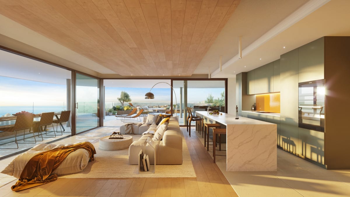 Rendered interior visualisation of HIGUERON SOUTH RESIDENCES with a kitchen island, dining table, seating area and glazed sliding doors leading to the terrace.
