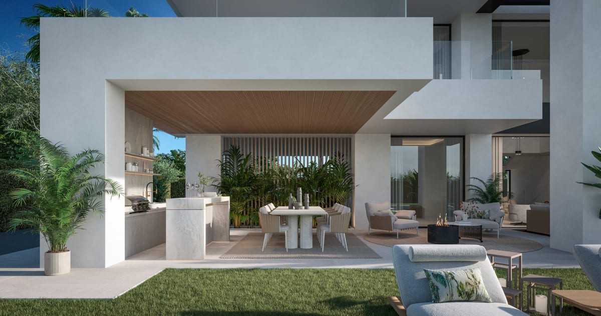 Visualisation of a covered terrace with an outdoor kitchen, dining table and lounge seating.