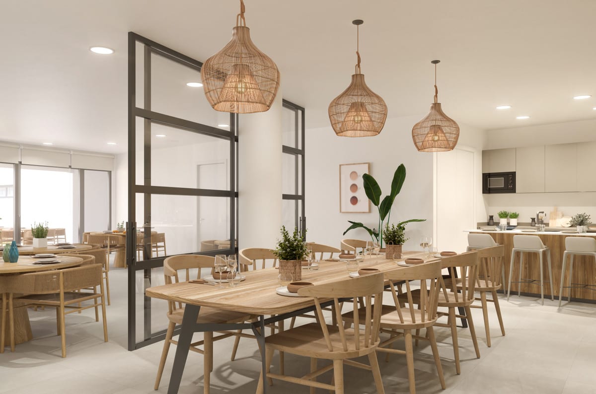 Interior visualisation of INSUR SCALA with a wooden dining table, wooden chairs, three woven pendant lights, a black steel-framed glass partition and an open-plan kitchen with bar stools.