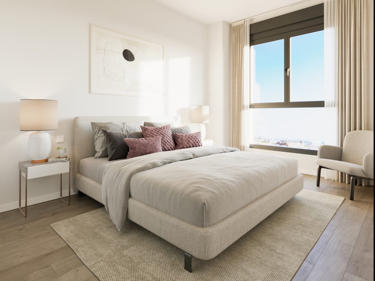 Bedroom visualisation of INSUR SCALA with an upholstered double bed, beige rug, wooden floor, bedside table with lamp, armchair and a large window with light curtains.