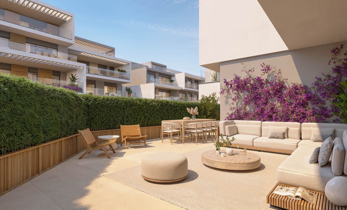 Project visualisation of a terrace at ISLA BELA with a cream corner sofa, rattan chairs, dining table and purple-flowering bougainvillea on the wall.
