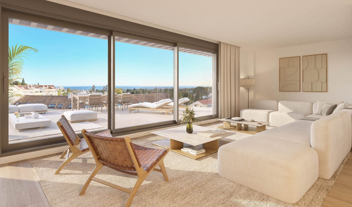 Project visualisation of the ISLA BELA living room with a white sofa, woven leather armchairs, large sliding doors and a terrace with the sea visible in the background.