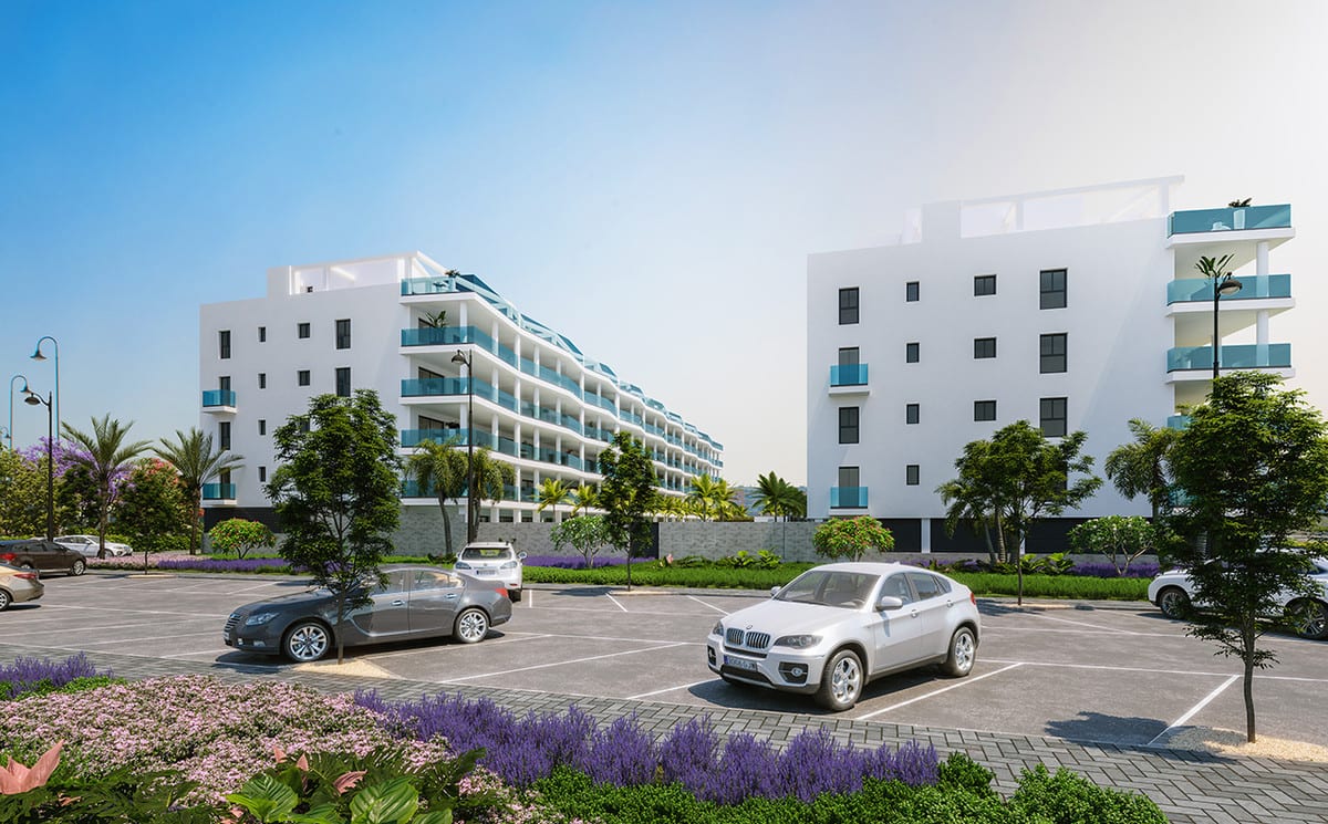 Rendered exterior visualisation of JARDINES DE LAS LAGUNAS FASE II featuring two white residential buildings, balconies with blue glass balustrades, a car park in the foreground and flowering planting.